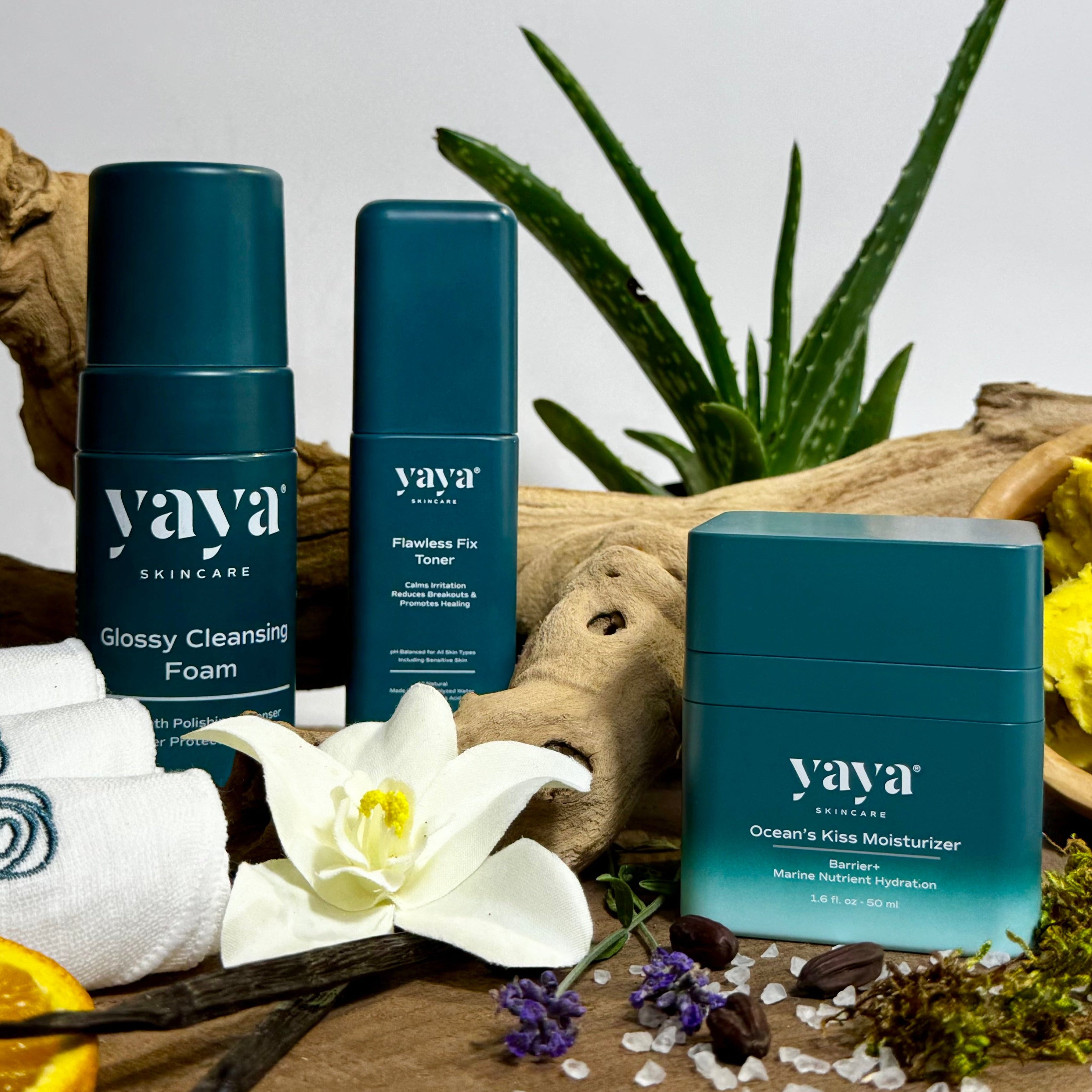 Yaya Skincare products highlighting natural ingredients including sea salt, aloe, vanilla, orange, sea moss, shea butter, jasmine, and jojoba.